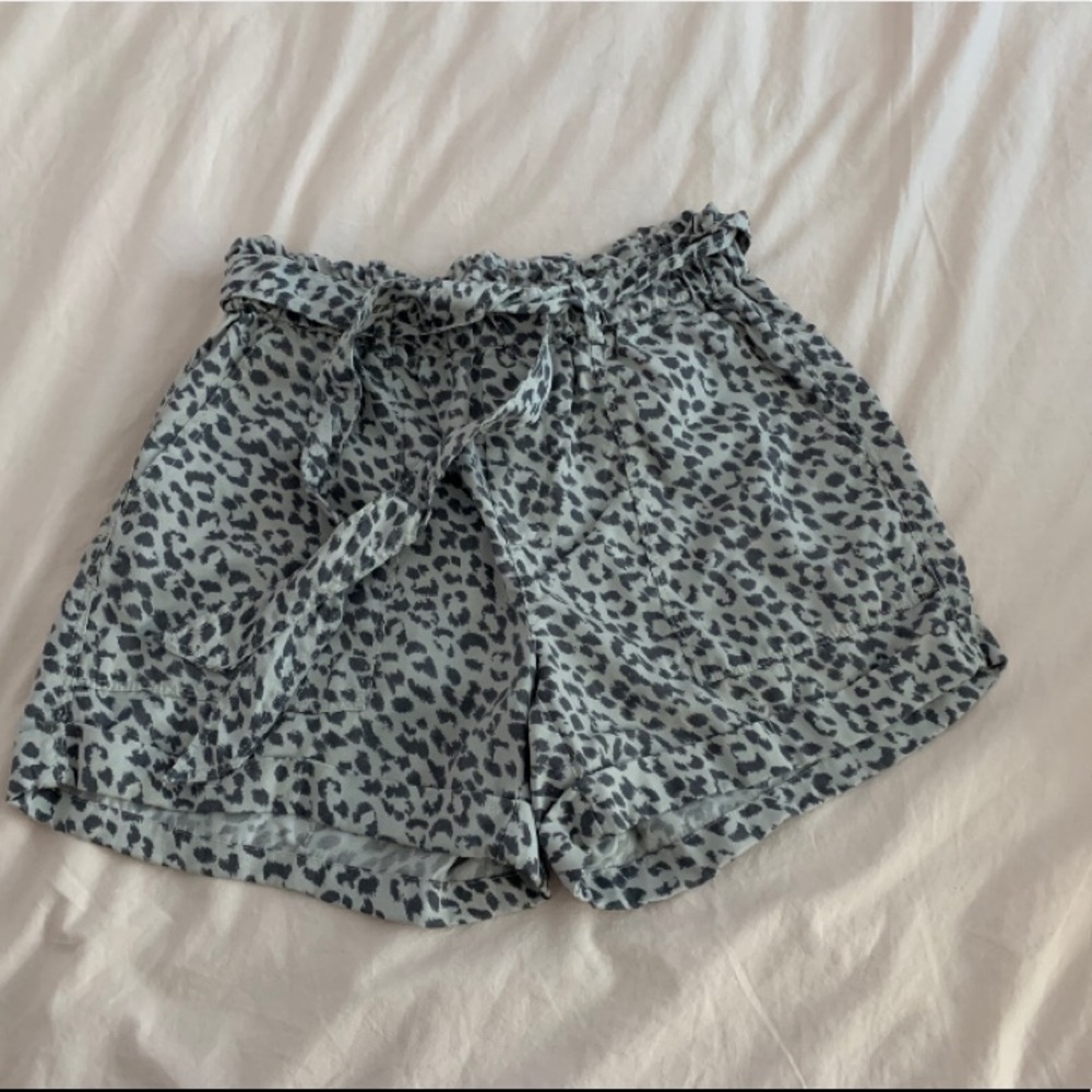 Light grey cheetah print cargo shorts.